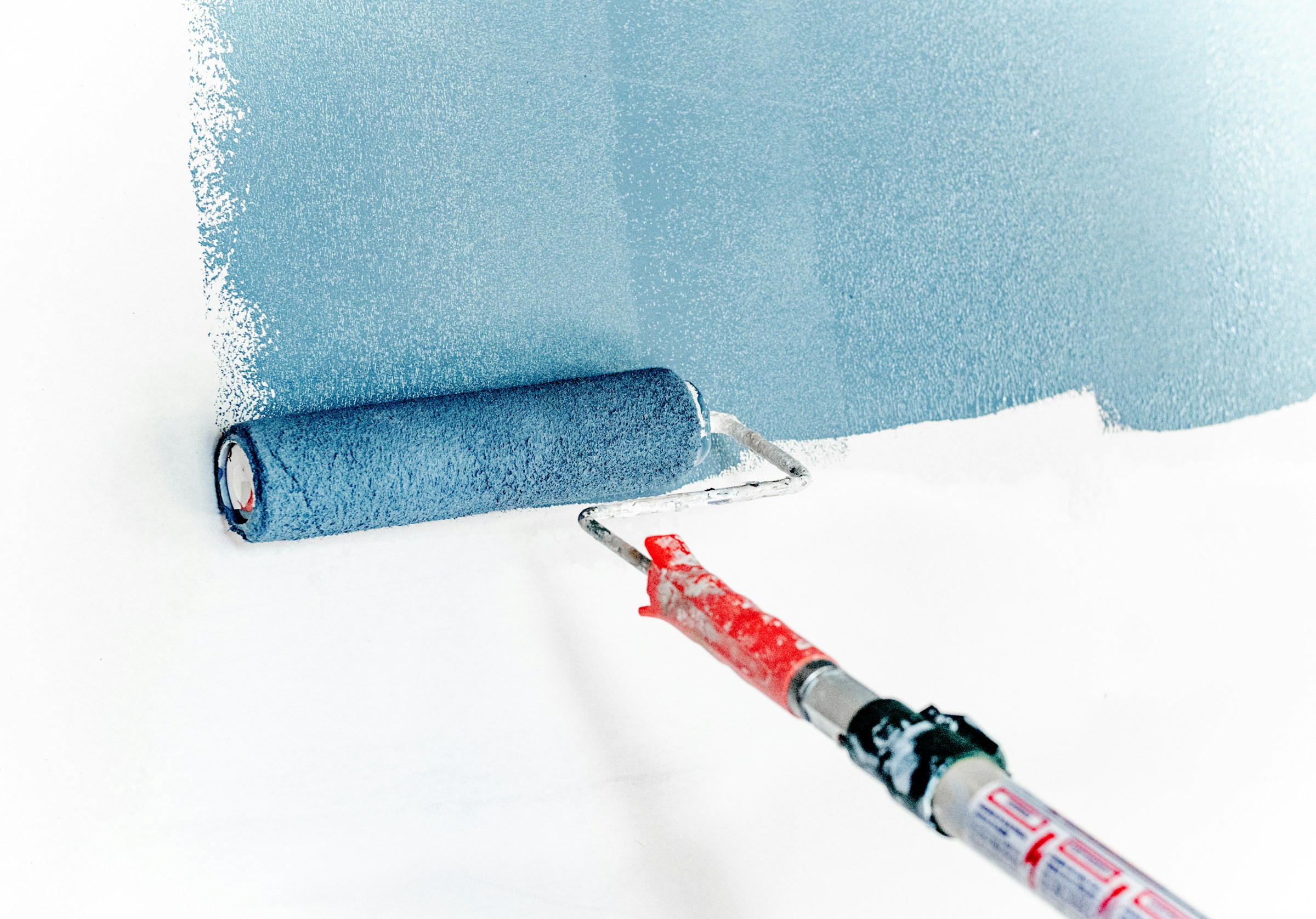 Painter working on a wall